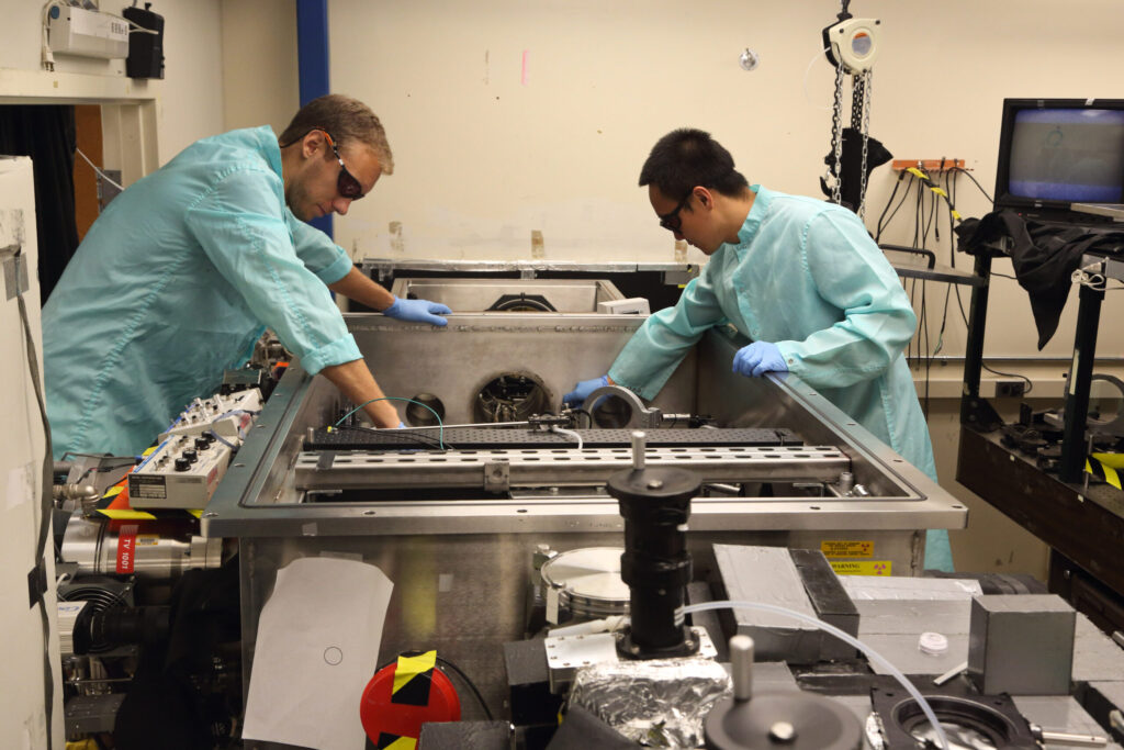two people working on machinery