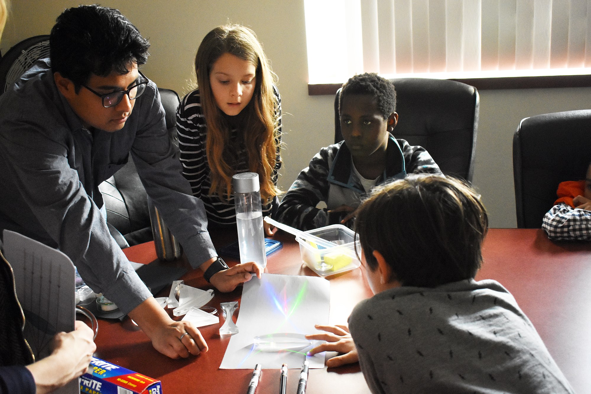 Kids learning about lasers